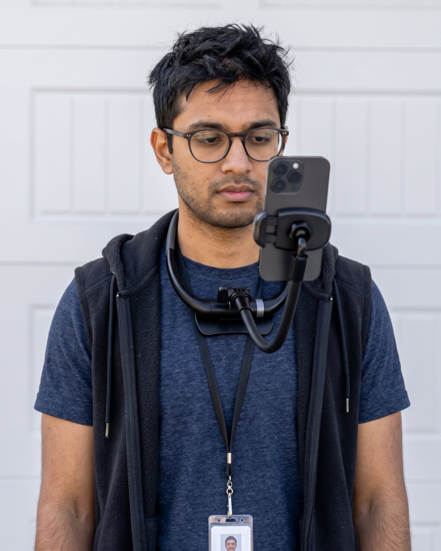 Man wearing Zero Hands, holding his phone in front of his face hands-free