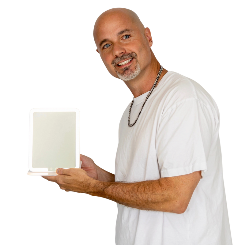Justin McClure holding the GlowGo Mirror Light