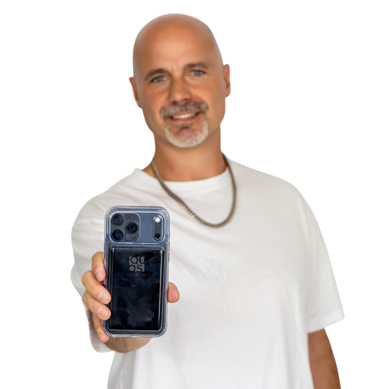 Justin McClure holding a phone with the Pocket Charge attached