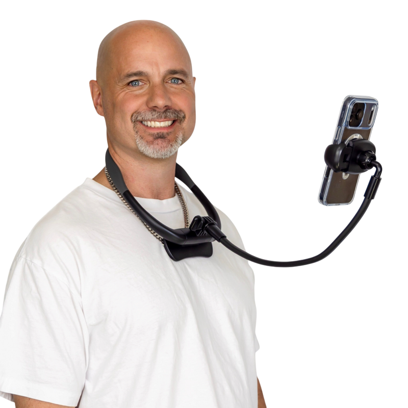 Justin McClure wearing Zero Hands holding his phone